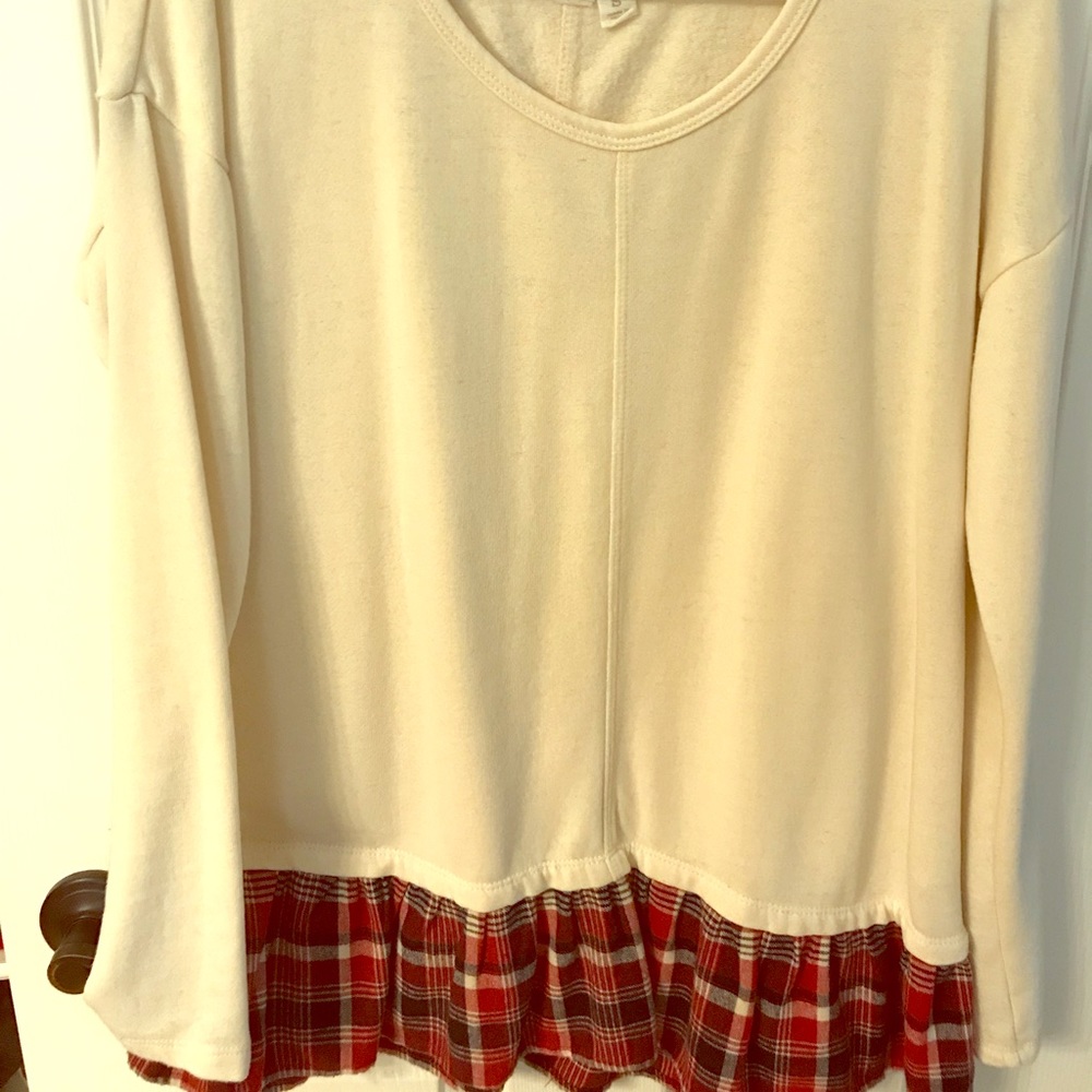 “Others Follow” cream top with plaid ruffle